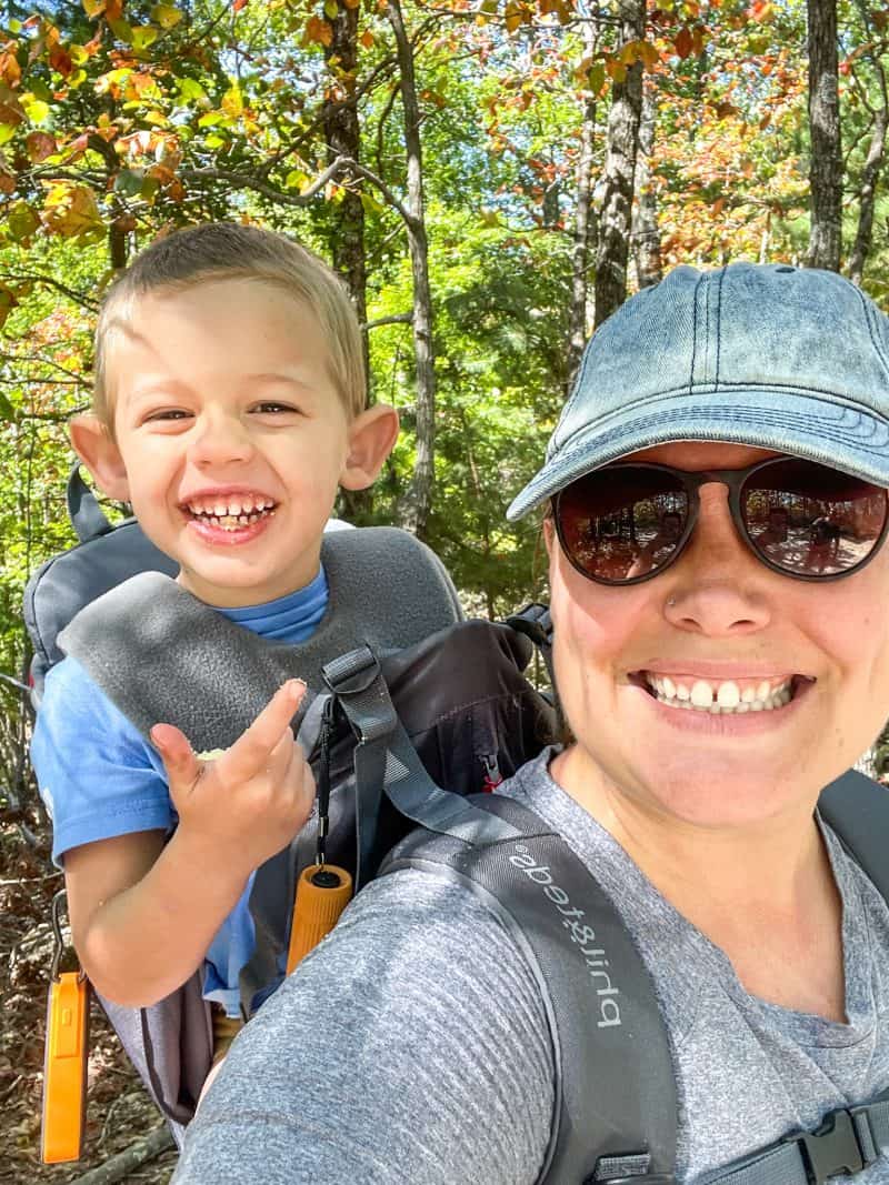 Hanging Rock State Park. Woman  carrying boy on back hiking