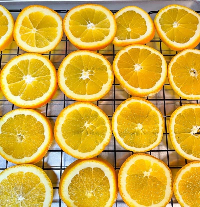 Rows of orange slices on a rack