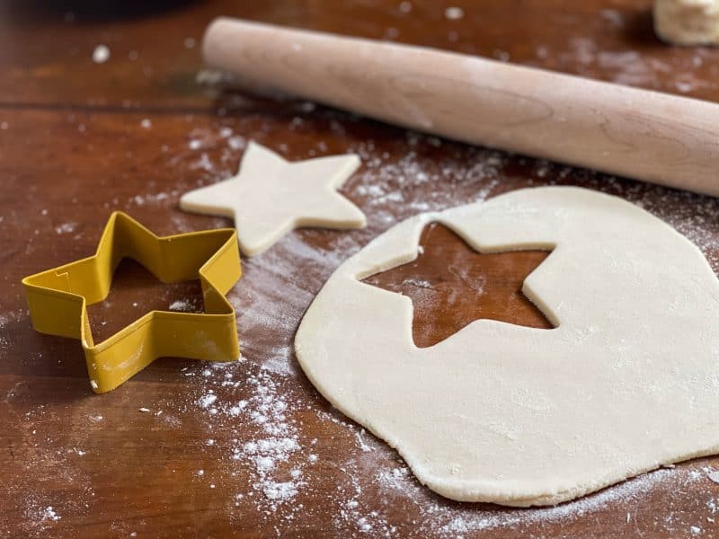 Salt dough rolled out on a table with a star cut out